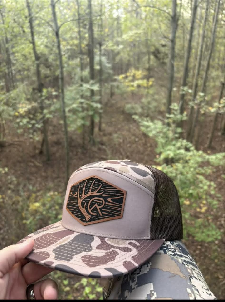 Cottonridge Outdoors camo hat in the woods